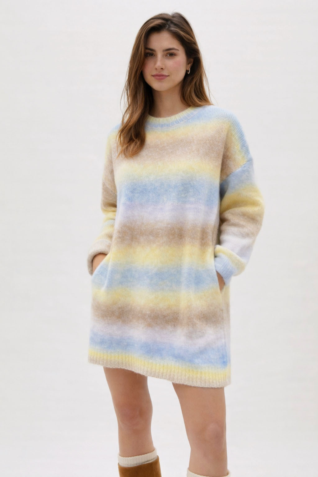 Woman wearing a striped sweater dress on a white background
