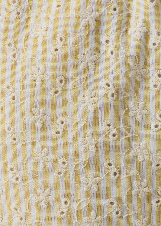 Textile pattern with yellow and white stripes and floral details